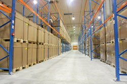Large warehouse with boxes stored on wooden pallets
